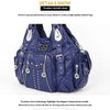 A dark blue PU leather hobo shoulder bag featuring silver hardware and floral embellishments.