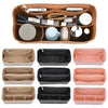 A collection of felt insert liners for handbags in various colors and shapes.