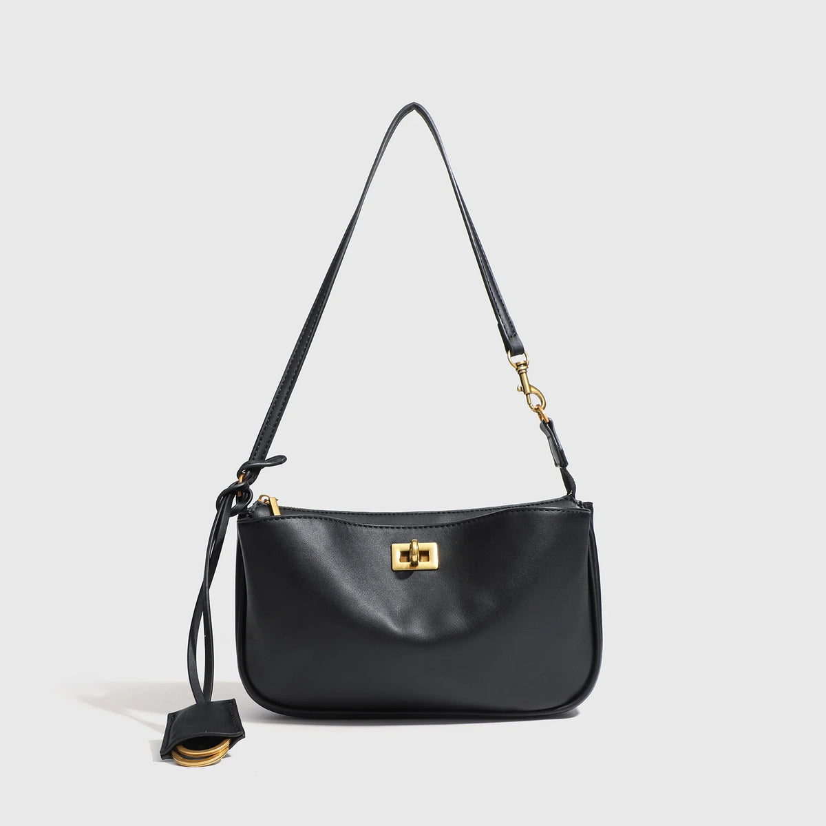 A black classic split leather shoulder tote bag with gold hardware.