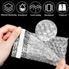 A hand is holding a clear, thick bubble mailer bag with white sealing tape, demonstrating its protective cushioning.