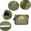 A olive green canvas shoulder bag with a flap closure and decorative embroidery.