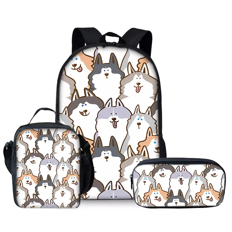 A set of three white wolf cartoon themed items including a backpack, lunch bag, and pencil case