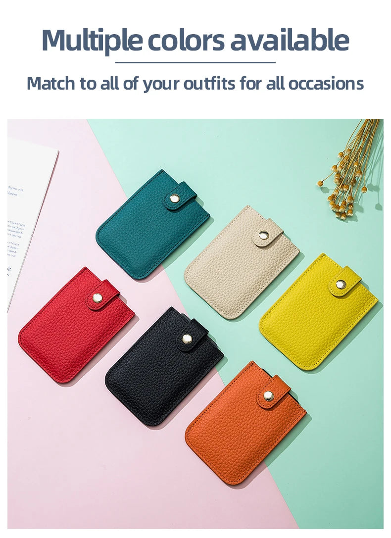 A collection of multiple colored genuine leather slim card holders displayed on a light pink and mint green background.