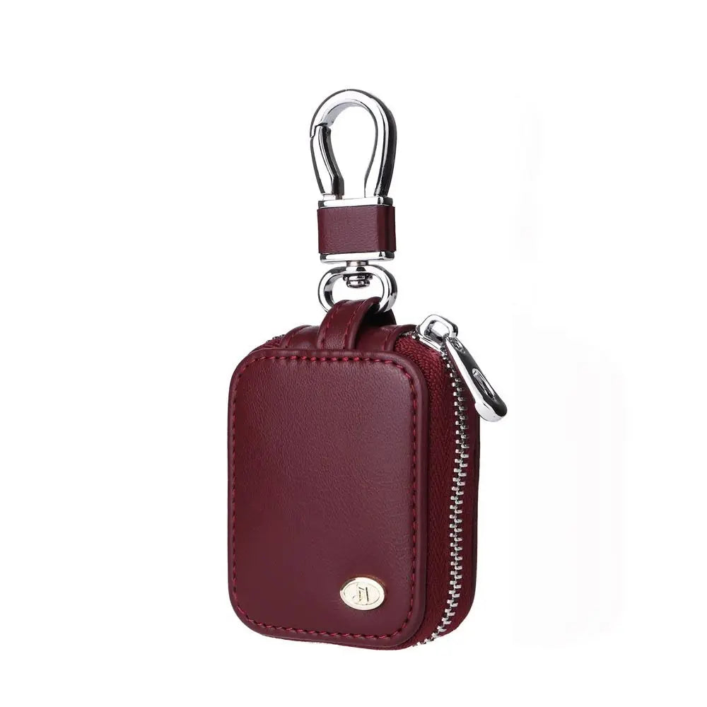 A maroon leather protective case with a silver clasp for earphones.