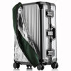 A silver waterproof luggage protector cover is shown partially open on a rolling suitcase.