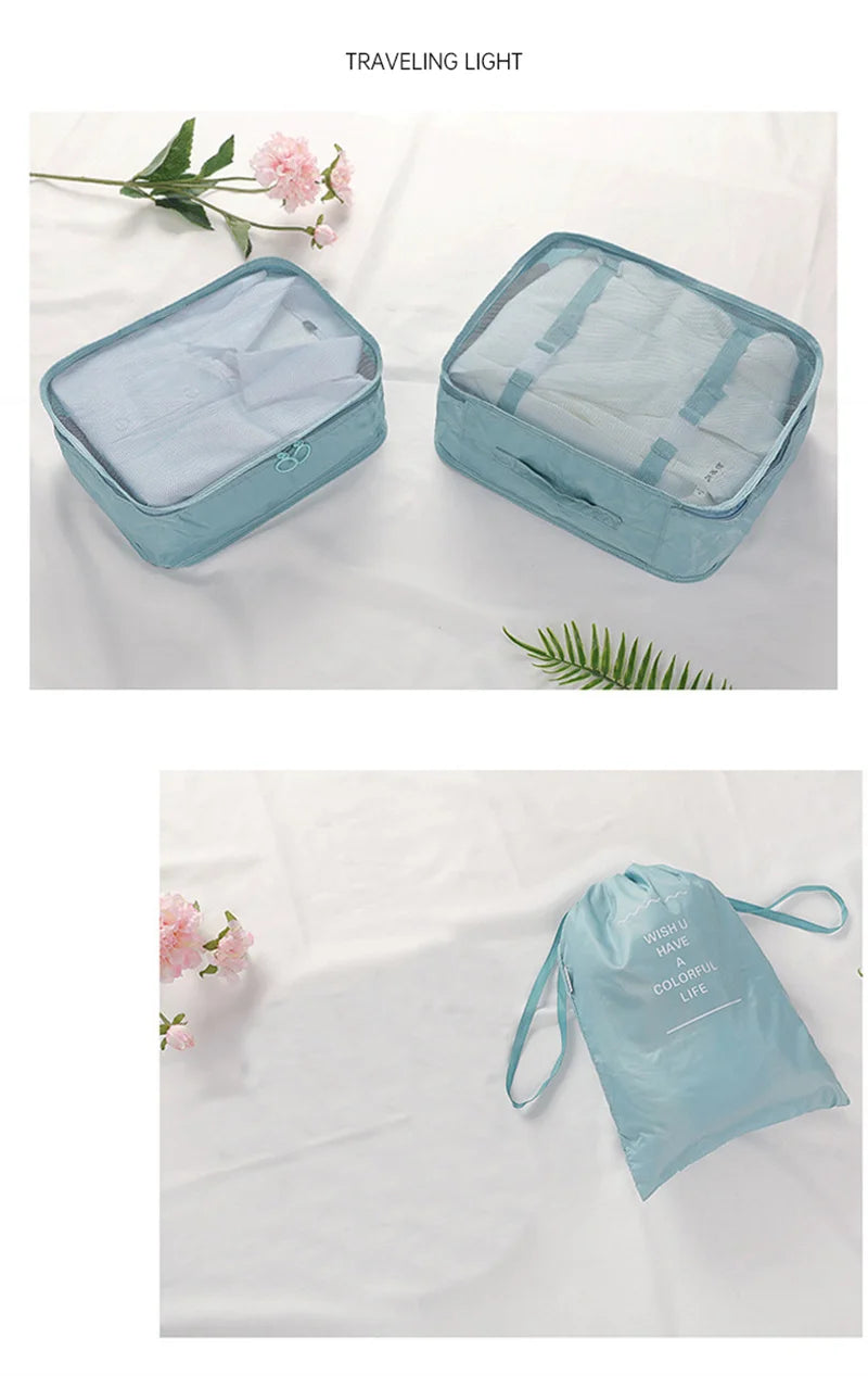 A light blue fabric travel light organizer set featuring a zippered storage bag and a separate drawstring pouch.