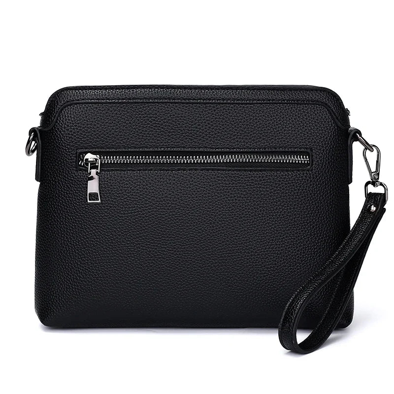 Black men's embossed crossbody clutch bag with a silver zipper and leather strap