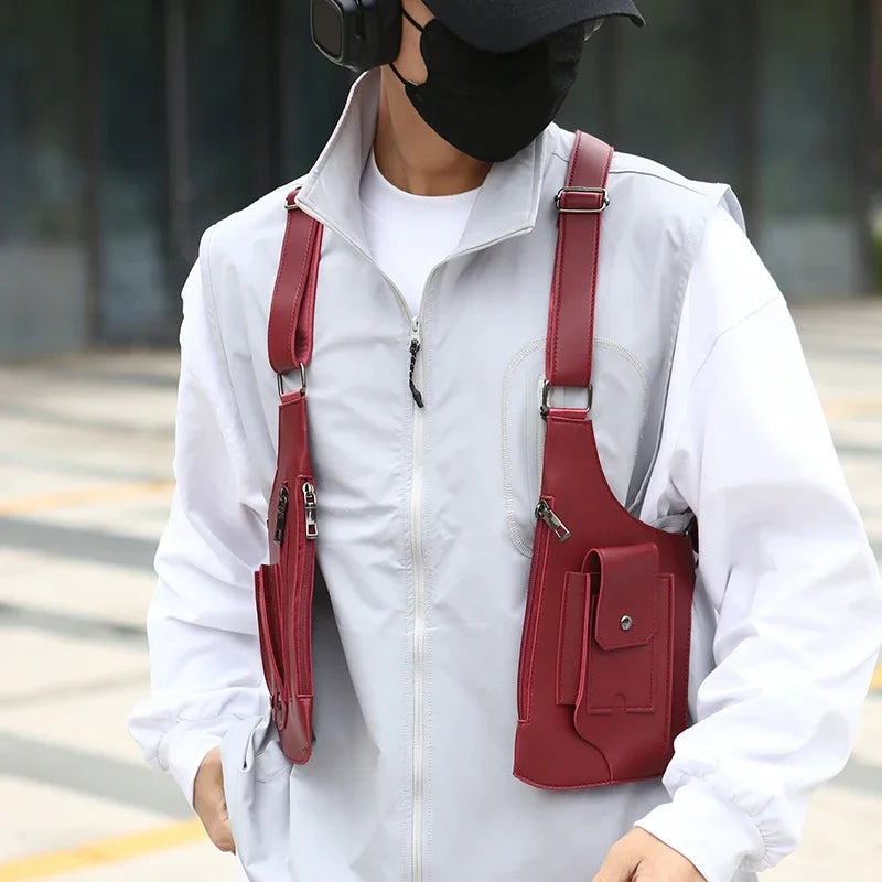 A person wearing a white jacket is carrying a maroon tactical chest bag with multiple pockets on their shoulder.