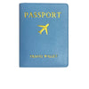 A light blue PU leather passport holder with gold foil printing of an airplane and the words PASSPORT and TRAVEL WALLET.
