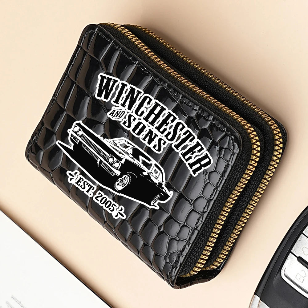 Black fashion PU leather double zipper wallet with gold stitching on a light background.