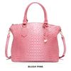 Blassrosa Krokodillenmuster-Top mit Tragegriffe und Crossbody-Tasche.