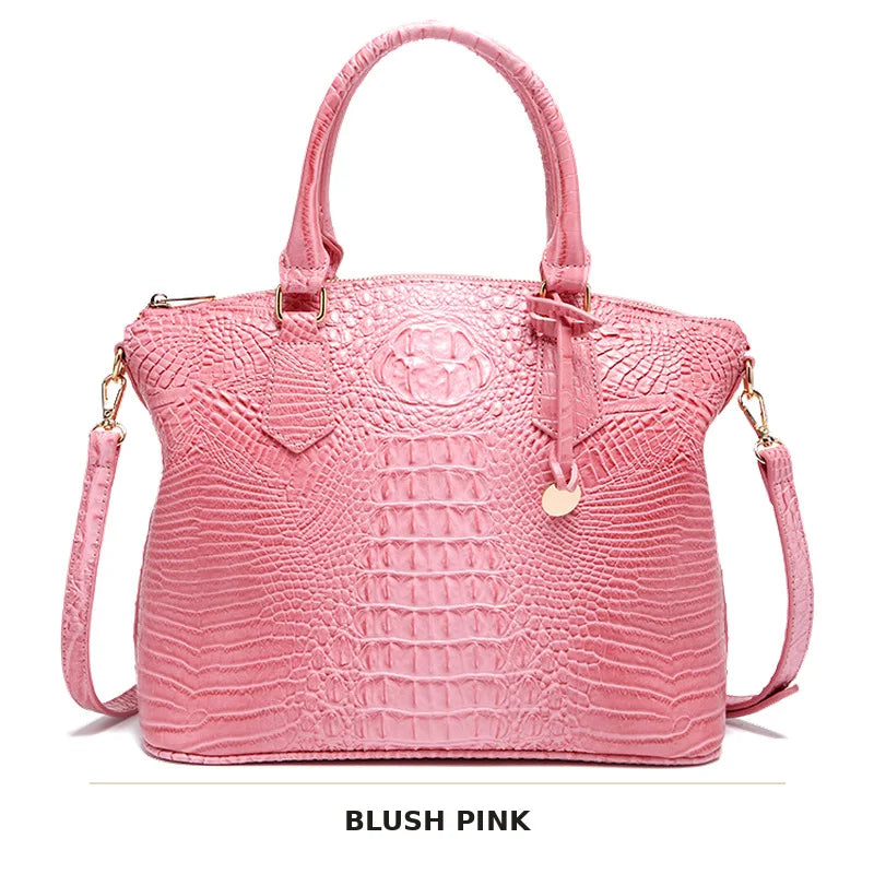 Blassrosa Krokodillenmuster-Top mit Tragegriffe und Crossbody-Tasche.