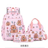 A pink cartoon animal backpack set featuring cute bear characters and various accessories.