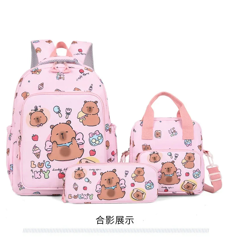 A pink cartoon animal backpack set featuring cute bear characters and various accessories.