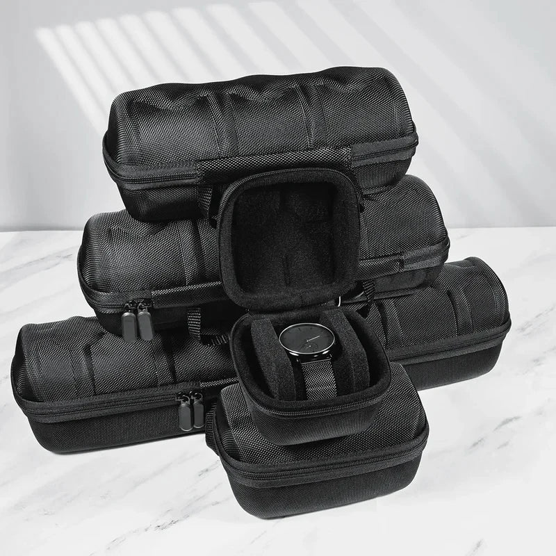 A stack of black premium leather watch organizer travel cases.