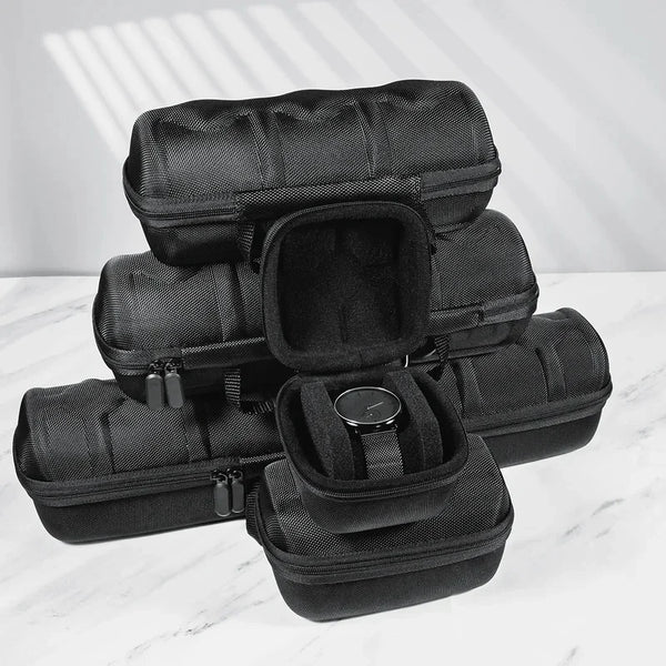 A stack of black premium leather watch organizer travel cases.