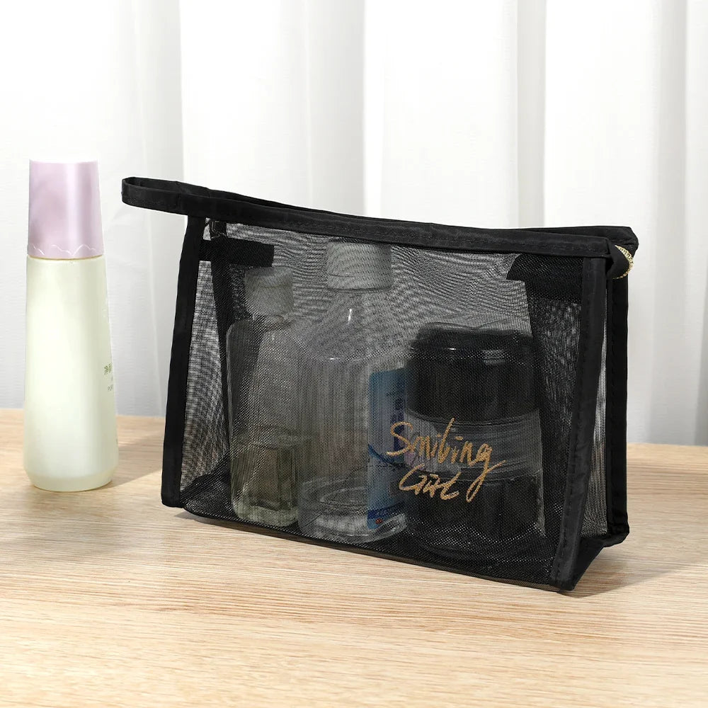 A black mesh travel cosmetic storage pouch is shown next to a white bottle.