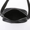 Black waterproof PU leather sling bag with a zippered opening shown from the front.