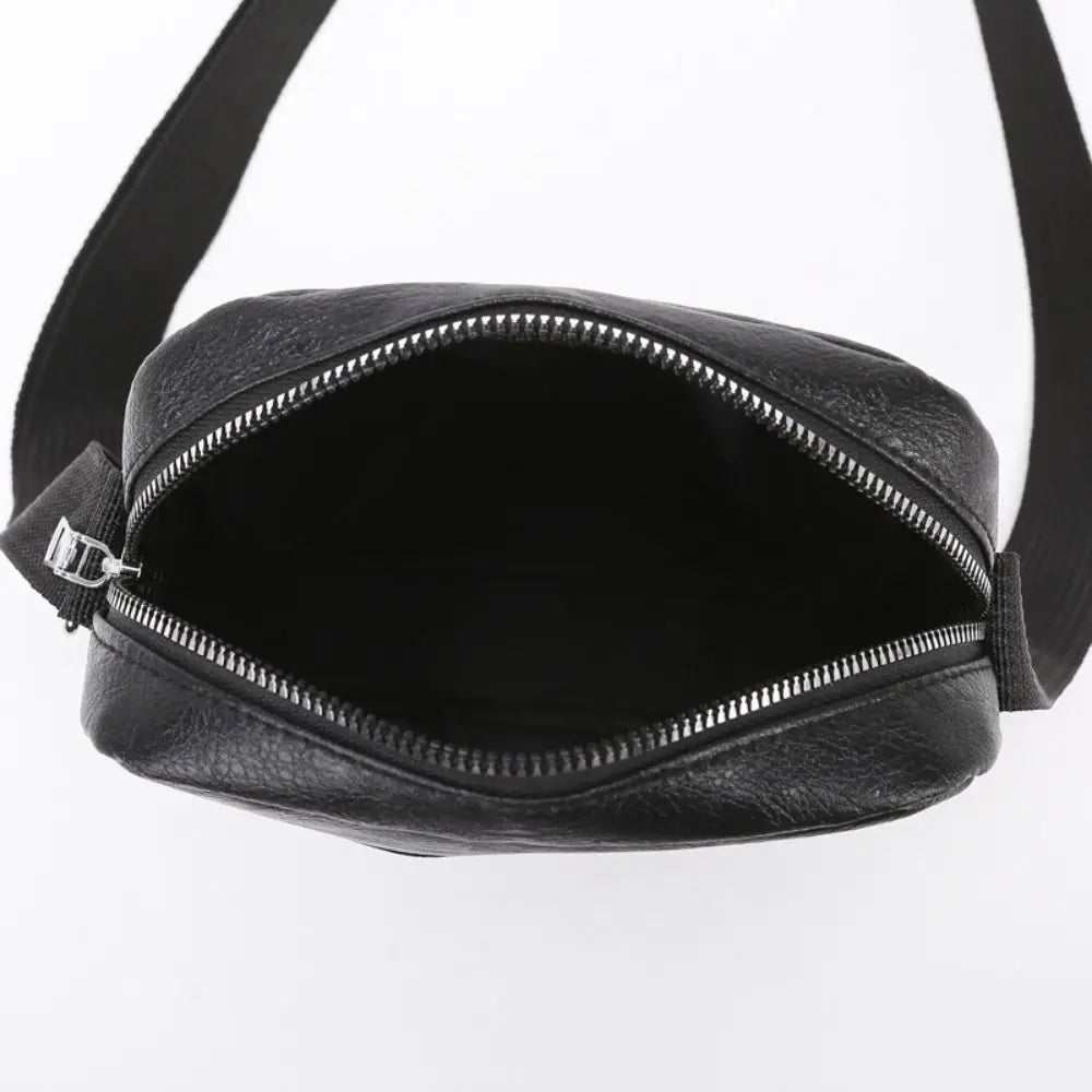 Black waterproof PU leather sling bag with a zippered opening shown from the front.