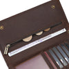A brown leather bifold wallet with a metal chain displaying US hundred-dollar bills and credit cards.