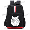 Black backpack featuring a white cartoon anime face design with black eyes and a circular outline.