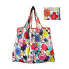 A reusable tote bag made of colorful floral print fabric with a matching fabric pouch.
