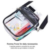 Clear transparent crossbody bag with adjustable strap containing various daily necessities and a smartphone.