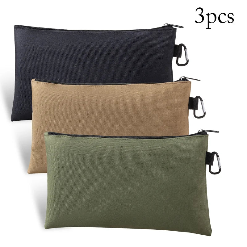 Three fabric organizer tool kit bags in black, beige, and olive green.