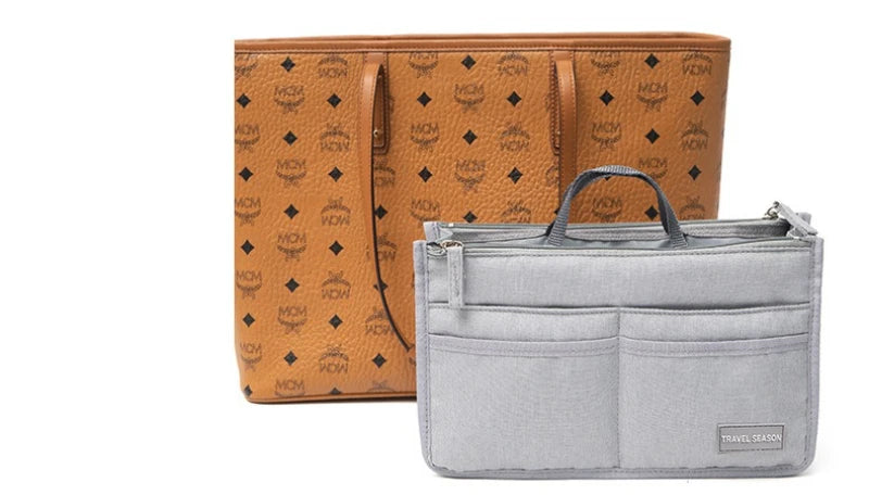 A tan patterned leather handbag is shown next to a gray fabric travel season organizer pouch.