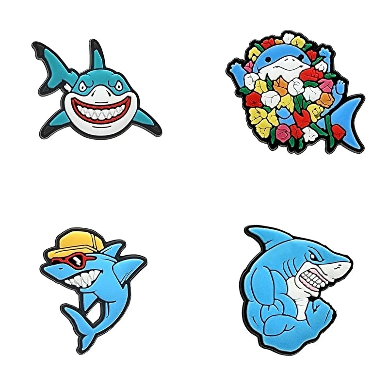 A set of decorative shoe charms and pins featuring various sea creatures, including a shark, a fish with flowers, and a blue 