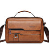 A brown retro faux leather crossbody bag with a leather handle and zipper details.