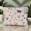 A light pink cartoon cat cosmetic pouch with paw prints and various cat illustrations.