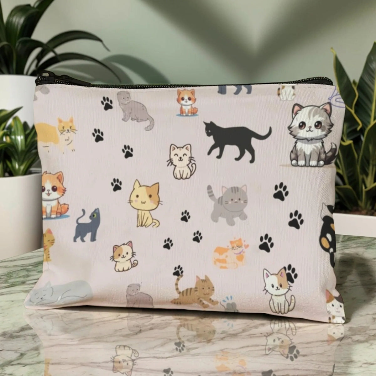 A light pink cartoon cat cosmetic pouch with paw prints and various cat illustrations.