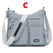 A gray waterproof nylon crossbody bag with a strap and multiple pockets is shown.