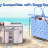 A light blue mesh organizer insert for a large tote bag, shown next to a measuring tape on a sandy beach.