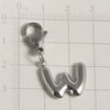 A silver stainless steel alphabet letter charm shaped like the letter W with a lobster clasp, measured against a ruler.