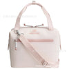 A light pink insulated cooler lunch bag with a detachable strap is shown against a white background.