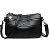 Bolso cruz de cuero negro y moderno para mujer con herrajes plateados