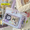 A purple transparent shoulder tote bag with a fluffy bear charm and decorative fabric details.