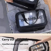 A black double-layer clear and dry wash bag is shown being carried in a hand and placed inside a travel suitcase.
