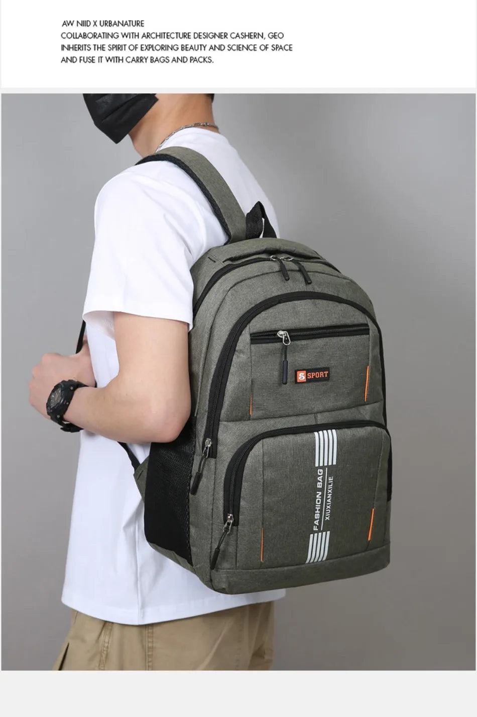 A man wearing a white t-shirt is holding a gray backpack with orange accents.