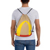 A person wearing a white t-shirt is carrying a yellow and orange kraft paper drawstring bag on their back.