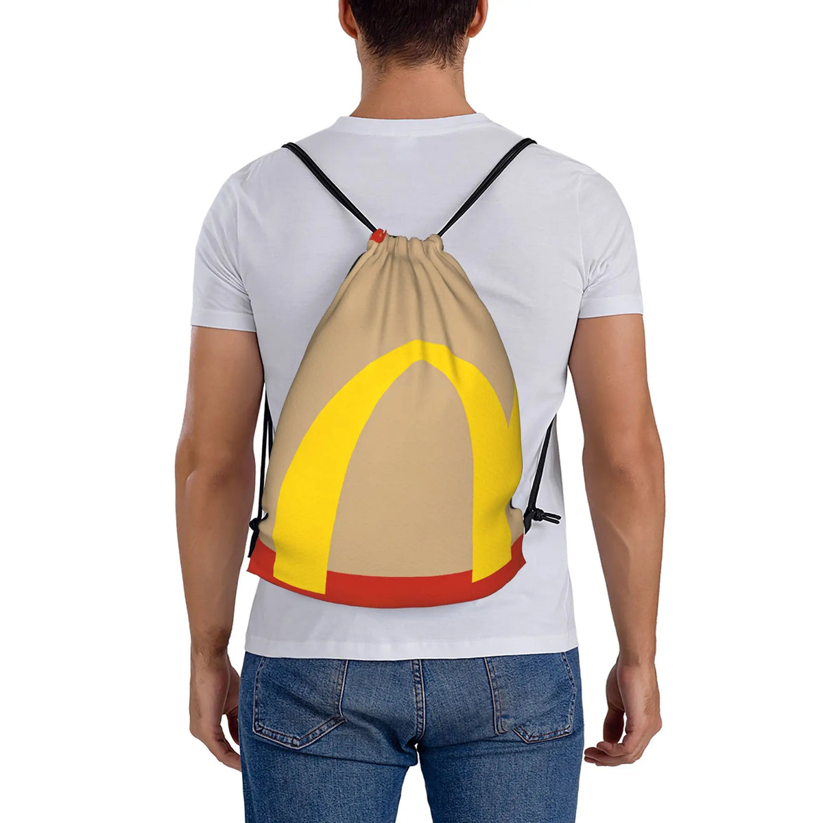 A person wearing a white t-shirt is carrying a yellow and orange kraft paper drawstring bag on their back.
