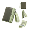 A green textured zip-around wallet shown with various compartments and a matching card holder.