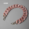 A 45cm pink acrylic resin detachable bag chain strap with silver clasps.
