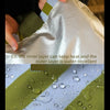 Close-up of an insulated lunch bag showing layers, with water droplets visible on the outer layer.