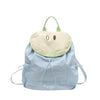 Light blue nylon messenger backpack with a pale yellow fabric flap and green straps