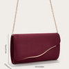 A deep burgundy velvet evening clutch with a gold chain strap shown against a light background.
