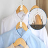 A wooden multi-hook wardrobe organizer displaying white and light blue shirts on hangers.