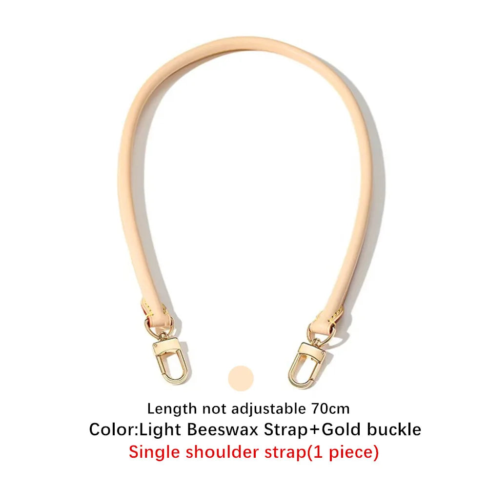 A light beige leather shoulder strap with a gold buckle shown against a white background.
